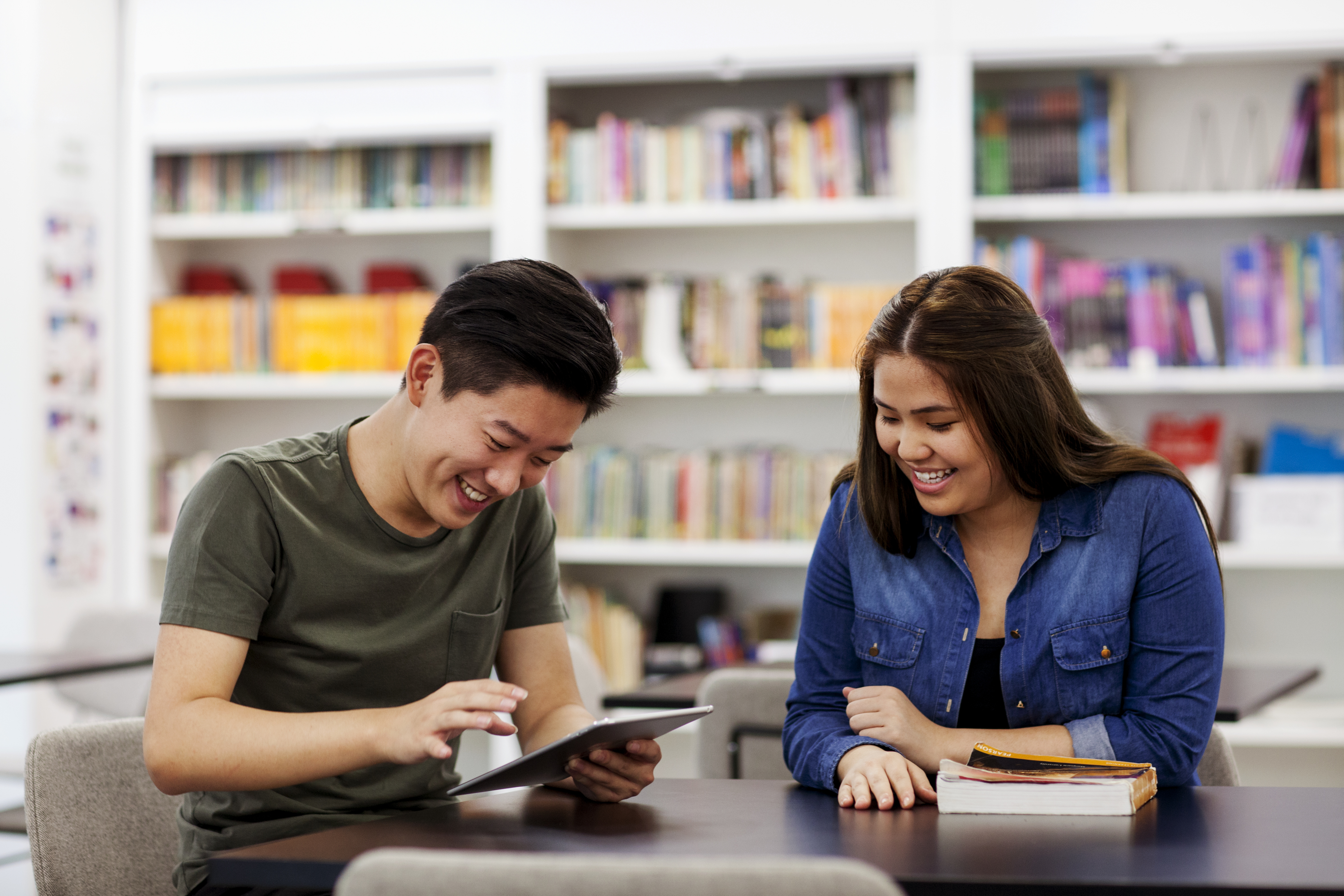 Pair of students studying in the library