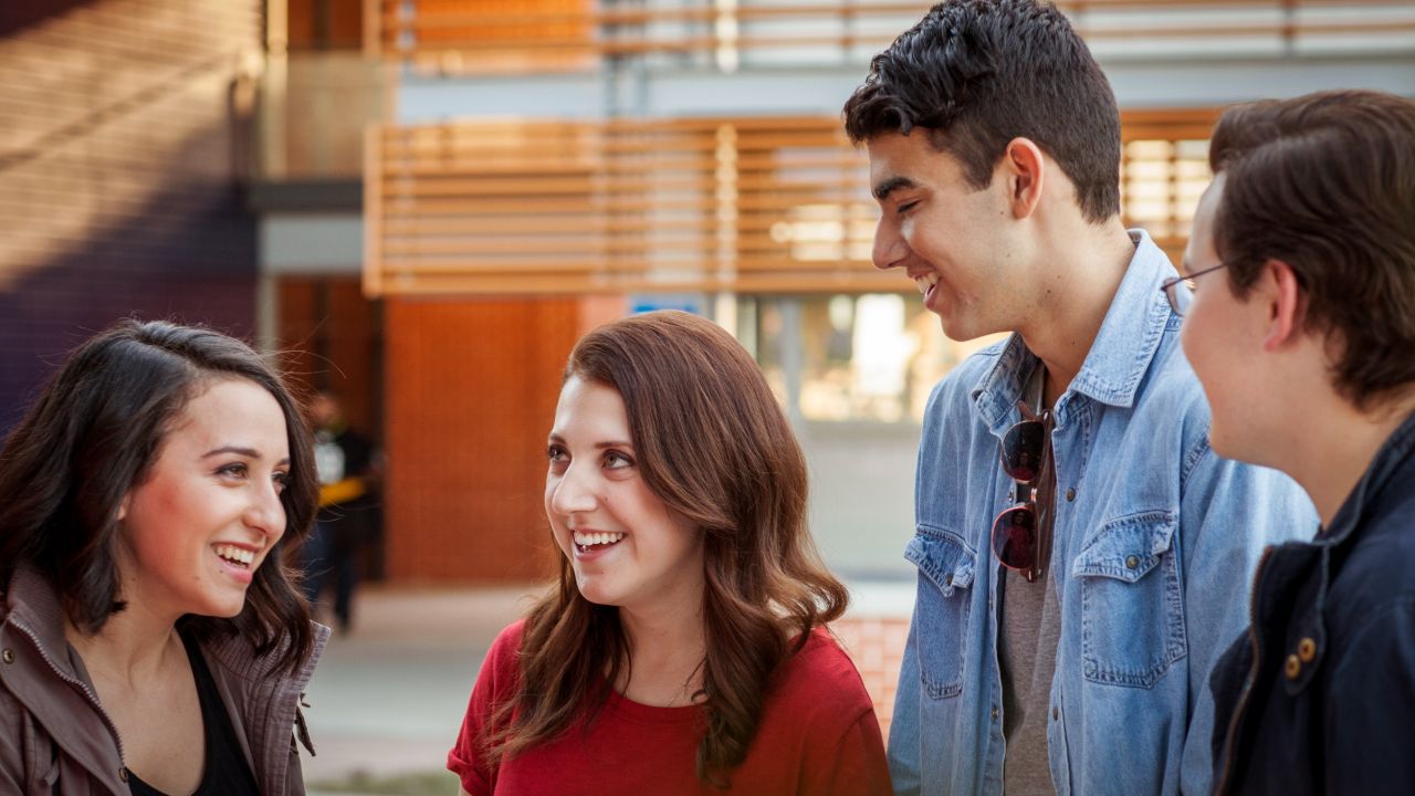 students talking on campus