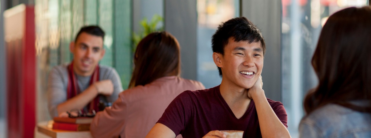 Two students sitting at a table in a cafe on Western Sydney University campus