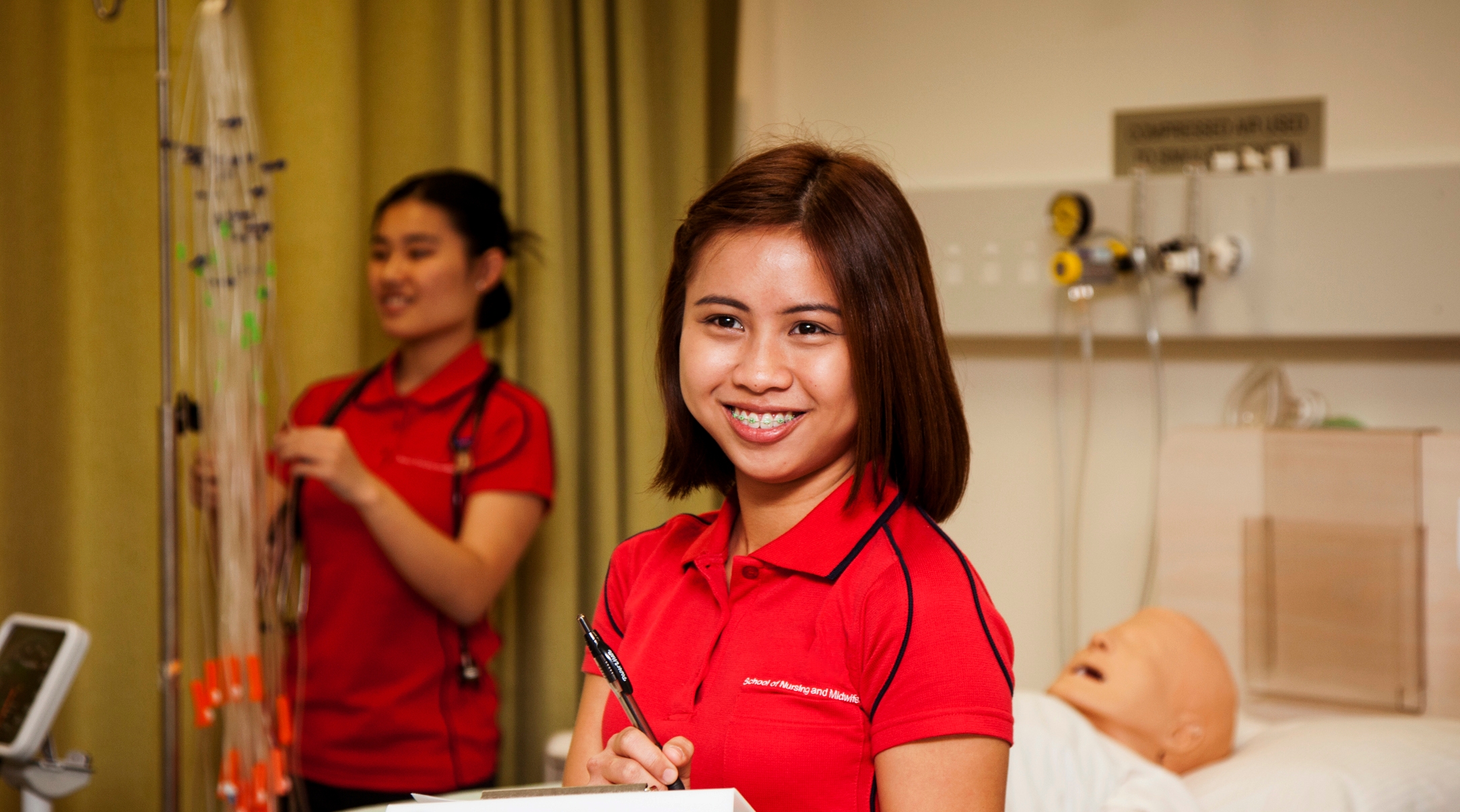 Three nursing students scrubbing in